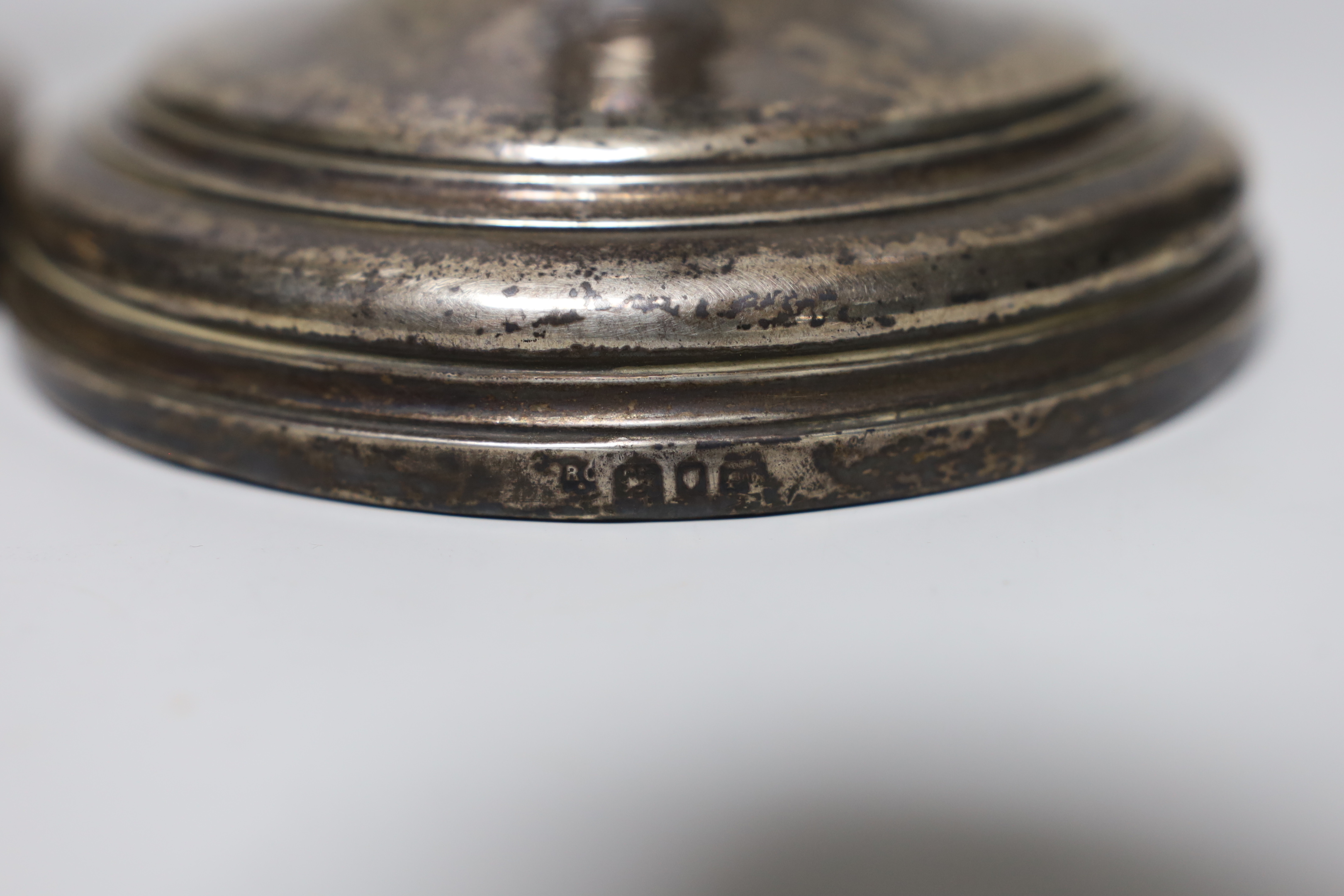 A pair of George V silver candlesticks, by William Comyns & Sons Ltd, London, 1930, height 29.6cm, weighted and eight pairs of silver fish eaters (no handles).